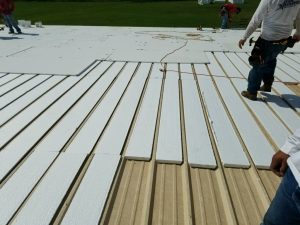 "Flute fill" insulation helps reduce labor costs on recovers of standing seam metal roofs.